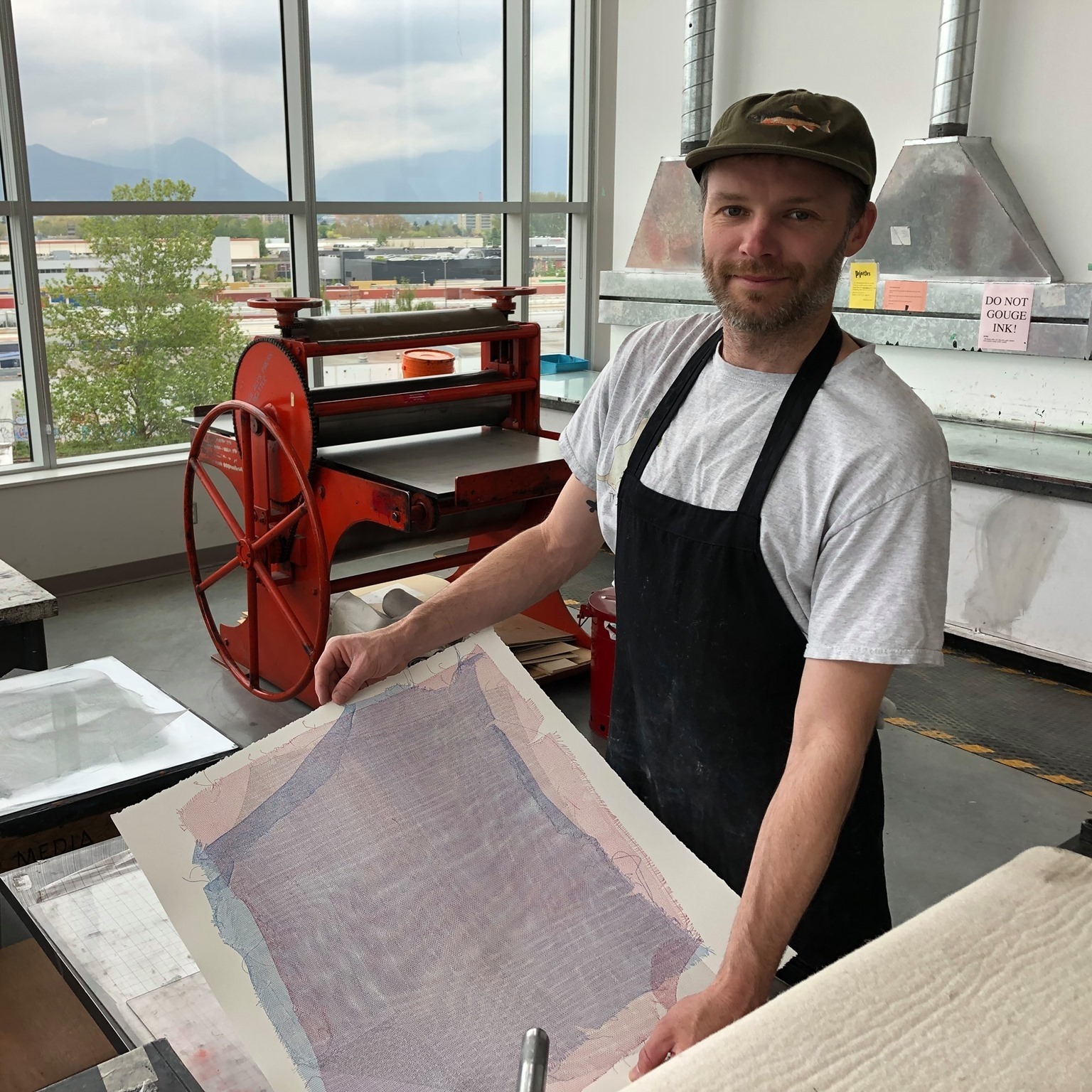 A Photo of Mark Johnsen working in a printmaking studio